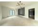 Bright bedroom with a unique ceiling and a gray feature wall with shelving and a built-in bench at 7013 Buckhead Dr, Raleigh, NC 27615