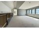 Large unfinished bedroom featuring black built-in cabinets, gray paint, and lots of light at 7013 Buckhead Dr, Raleigh, NC 27615