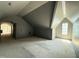 Large bonus room featuring dormer window with abundant natural light and architectural ceilings at 7013 Buckhead Dr, Raleigh, NC 27615
