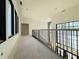 Hallway with several black-trimmed windows overlooking a staircase at 7013 Buckhead Dr, Raleigh, NC 27615