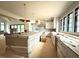 Bright and open kitchen with large island, white cabinets, stainless appliances, and eat in bar at 7013 Buckhead Dr, Raleigh, NC 27615