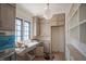 This kitchen features custom cabinets, stainless steel appliances, and a large pantry at 7013 Buckhead Dr, Raleigh, NC 27615