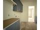 Laundry room area features custom cabinets and plenty of room for laundry activities at 7013 Buckhead Dr, Raleigh, NC 27615