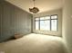 Living room featuring elegant trim and a large picture window at 7013 Buckhead Dr, Raleigh, NC 27615