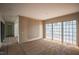 Spacious living room with large windows and decorative wall paneling that brings a contemporary touch at 7013 Buckhead Dr, Raleigh, NC 27615