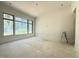 Bright living room featuring large windows offering natural light and a clean, minimalist design at 7013 Buckhead Dr, Raleigh, NC 27615