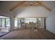 An open concept living room leads to a kitchen with light cabinetry and a large island at 7013 Buckhead Dr, Raleigh, NC 27615