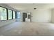Large unfinished living room featuring gray paint, multiple windows, and open floor plan at 7013 Buckhead Dr, Raleigh, NC 27615