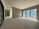 New room with vertical wall panels and many windows overlooking the outside at 7013 Buckhead Dr, Raleigh, NC 27615