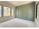 Room with a wall of arched panels and several windows at 7013 Buckhead Dr, Raleigh, NC 27615