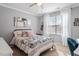 Bright bedroom featuring a bed, window, and plenty of natural light at 891 Cupola Dr, Raleigh, NC 27603