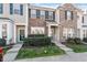 Brick front exterior of charming townhome with landscaping at 891 Cupola Dr, Raleigh, NC 27603