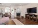 Open concept living space with fireplace and hardwood floors at 891 Cupola Dr, Raleigh, NC 27603