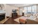Living room features fireplace and large windows at 891 Cupola Dr, Raleigh, NC 27603