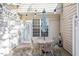 Private patio with table, chairs, and string lights at 891 Cupola Dr, Raleigh, NC 27603
