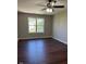 Spacious bedroom with hardwood floors and ceiling fan at 9201 Sayornis Ct, Raleigh, NC 27615