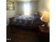 Cozy bedroom with hardwood floors, a ceiling fan, and neutral walls at 9201 Sayornis Ct, Raleigh, NC 27615