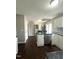 Bright and spacious kitchen featuring stainless steel appliances and dark hardwood floors at 9201 Sayornis Ct, Raleigh, NC 27615