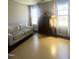 Bright bedroom featuring hardwood floors, natural light, and a seating area at 9201 Sayornis Ct, Raleigh, NC 27615