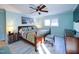 Bright bedroom with hardwood floors, large bed, and plenty of natural light at 1009 Deboy St, Raleigh, NC 27606