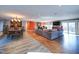 Spacious living room with hardwood floors, fireplace, and access to deck at 1009 Deboy St, Raleigh, NC 27606