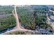 Aerial view of wooded lot and property lines near a road at 1100 Ben Smith Road Rd, Siler City, NC 27344
