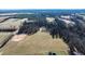 Aerial view of land with fields and trees at 1100 Ben Smith Road Rd, Siler City, NC 27344