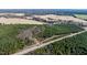 Aerial view showing a large lot of land near a road at 1100 Ben Smith Road Rd, Siler City, NC 27344