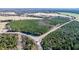 Aerial view of a wooded lot at a road intersection at 1100 Ben Smith Road Rd, Siler City, NC 27344