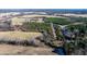 Aerial view showing land with fields and trees at 1100 Ben Smith Road Rd, Siler City, NC 27344