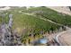 Aerial view of a wooded lot with a pond at 1100 Ben Smith Road Rd, Siler City, NC 27344
