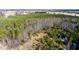 Aerial view of a wooded lot with some cleared areas at 1100 Ben Smith Road Rd, Siler City, NC 27344