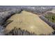 Aerial view of land with a utility pole and open field at 1100 Ben Smith Road Rd, Siler City, NC 27344