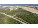 Aerial view of a large wooded lot with road frontage at 1100 Ben Smith Road Rd, Siler City, NC 27344
