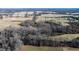 Aerial view of land with fields and a home at 1100 Ben Smith Road Rd, Siler City, NC 27344