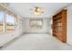 Dining room with built in shelving and carpet at 1100 Ben Smith Road Rd, Siler City, NC 27344