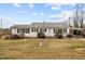 Ranch house with white siding, front porch, and a spacious yard at 1100 Ben Smith Road Rd, Siler City, NC 27344