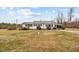 White ranch house with front porch and yard at 1100 Ben Smith Road Rd, Siler City, NC 27344