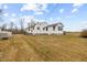 Side view of the house with stone foundation at 1100 Ben Smith Road Rd, Siler City, NC 27344