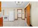 View of kitchen with white appliances and wood cabinets at 1100 Ben Smith Road Rd, Siler City, NC 27344