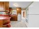Kitchen with wood cabinets, red countertops, and a window at 1100 Ben Smith Road Rd, Siler City, NC 27344