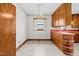 Kitchen with wood cabinets and red countertop at 1100 Ben Smith Road Rd, Siler City, NC 27344