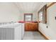 Functional laundry room, featuring a sink and storage at 1100 Ben Smith Road Rd, Siler City, NC 27344