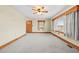 Spacious living room with wood trim and carpet at 1100 Ben Smith Road Rd, Siler City, NC 27344