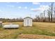 View of shed and propane tank in the backyard at 1100 Ben Smith Road Rd, Siler City, NC 27344