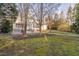 Spacious backyard with patio and mature trees at 114 Legault Dr, Cary, NC 27513