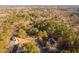 Aerial view of homes surrounded by a forest in a rural setting at 1210 Huntsman Dr, Durham, NC 27713