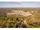An aerial view of a large housing development surrounded by dense woods at 1210 Huntsman Dr, Durham, NC 27713