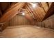 Unfinished attic reveals wooden framework, offering a blank canvas for customization and ample storage potential at 1210 Huntsman Dr, Durham, NC 27713