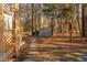 Shaded backyard featuring a shed with a stone pathway, offering a tranquil and private outdoor space at 1210 Huntsman Dr, Durham, NC 27713